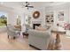 Cozy living room with a fireplace, built-in shelving, and large windows providing natural light at 5247 Flannery Chase Sw, Powder Springs, GA 30127