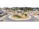 Landscaped roundabout adds charm and helps manage traffic flow in the neighborhood at 5247 Flannery Chase Sw, Powder Springs, GA 30127
