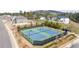 Community tennis courts with lights, benches, and pavilion are surrounded by manicured landscaping at 5247 Flannery Chase Sw, Powder Springs, GA 30127