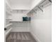 Spacious walk-in closet with ample shelving and storage, and plush carpet at 5247 Flannery Chase Sw, Powder Springs, GA 30127