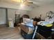 Basement filled with lots of boxes, with a ceiling fan and light fixture at 5602 Ardmore Ct, Sugar Hill, GA 30518