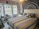 Charming bedroom with colorful decor, plush bedding, and a cozy atmosphere at 5602 Ardmore Ct, Sugar Hill, GA 30518