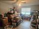 Bedroom filled with lots of boxes, with a ceiling fan and light fixture at 5602 Ardmore Ct, Sugar Hill, GA 30518