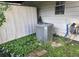 Exterior showcasing the home's AC unit surrounded by greenery at 5602 Ardmore Ct, Sugar Hill, GA 30518