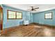 Bright bedroom with hardwood floors, a large window, and a ceiling fan at 671 Shannon Green Sw Cir, Mableton, GA 30126
