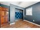 Cozy bedroom with wood floors, gray walls and a closet with acoustic foam panels at 671 Shannon Green Sw Cir, Mableton, GA 30126