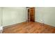 Empty bedroom with neutral walls and wood floors, showcasing potential for customization at 671 Shannon Green Sw Cir, Mableton, GA 30126