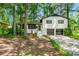Inviting home with brick accents, mature trees and an attached two-car garage at 671 Shannon Green Sw Cir, Mableton, GA 30126