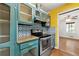 Cozy kitchen features granite countertops, unique backsplash, and stainless steel appliances at 671 Shannon Green Sw Cir, Mableton, GA 30126