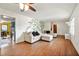 Spacious living room has hardwood flooring and access to kitchen and dining area at 671 Shannon Green Sw Cir, Mableton, GA 30126