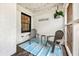 Comfortable porch with two gray Adirondack chairs, string lights, and brick walls at 671 Shannon Green Sw Cir, Mableton, GA 30126