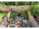 Backyard patio with stone pavers, Adirondack chairs, fire pit, plants, and string lights at 951 Glenwood Se Ave # 1805, Atlanta, GA 30316
