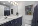 Bathroom with blue vanity and white countertop and toilet at 951 Glenwood Se Ave # 1805, Atlanta, GA 30316