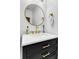 Elegant bathroom with a black vanity, marble countertop, and gold fixtures at 951 Glenwood Se Ave # 1805, Atlanta, GA 30316