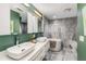 Luxurious bathroom with double sinks, a soaking tub, and modern marble tiling at 951 Glenwood Se Ave # 1805, Atlanta, GA 30316