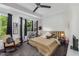 Inviting bedroom with a plush bed, bay window, and a relaxing sitting area at 951 Glenwood Se Ave # 1805, Atlanta, GA 30316