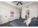 Bedroom with ensuite bathroom, gray carpeting, white dresser, and large bed with gray bedding at 951 Glenwood Se Ave # 1805, Atlanta, GA 30316