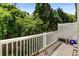 Relaxing outdoor deck with white railing and views of the surrounding greenery at 951 Glenwood Se Ave # 1805, Atlanta, GA 30316
