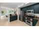 Open kitchen with stainless steel appliances and granite countertops at 951 Glenwood Se Ave # 1805, Atlanta, GA 30316
