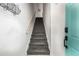 Interior staircase featuring neutral walls, black treads and a wooden handrail at 951 Glenwood Se Ave # 1805, Atlanta, GA 30316