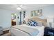 Comfortable bedroom featuring a ceiling fan, large art piece, and relaxing colors at 3533 Keswick Dr, Atlanta, GA 30341