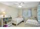 Bright bedroom with white furniture and playful decor at 3533 Keswick Dr, Atlanta, GA 30341