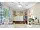 Shared bedroom with white furniture, large built-in shelves, and a window at 3533 Keswick Dr, Atlanta, GA 30341