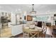 Open kitchen with granite countertops, stainless steel appliances, and adjacent dining area at 3533 Keswick Dr, Atlanta, GA 30341