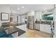 Open kitchen with granite countertops, stainless steel appliances, and adjacent dining area at 3533 Keswick Dr, Atlanta, GA 30341