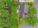 Aerial view of home with a brick patio featuring an outdoor fireplace at 1185 Charter Club Dr, Lawrenceville, GA 30043