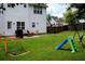 Lush backyard featuring a play set, soccer net, and outdoor seating area at 1185 Charter Club Dr, Lawrenceville, GA 30043