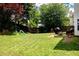 Large backyard featuring a playset, grilling area, and ample green space at 1185 Charter Club Dr, Lawrenceville, GA 30043