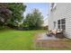Green backyard featuring a beautiful lawn, and an outdoor seating area with a patio at 1185 Charter Club Dr, Lawrenceville, GA 30043
