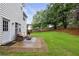 Backyard with a patio, outdoor seating, and lush green lawn at 1185 Charter Club Dr, Lawrenceville, GA 30043