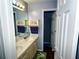 Bathroom with dual sinks and a large mirror at 1185 Charter Club Dr, Lawrenceville, GA 30043