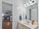 Bathroom with a modern vanity and a view into the adjacent living area, offering an open feel at 1185 Charter Club Dr, Lawrenceville, GA 30043