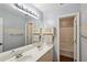 Bathroom with double sink vanity, large mirror, tub and shower with painted blue walls at 1185 Charter Club Dr, Lawrenceville, GA 30043