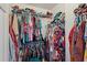 Walk-in closet containing lots of clothing hung on racks and stacked on shelves at 1185 Charter Club Dr, Lawrenceville, GA 30043