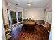 A dining room with a table, bench, hutch, and a bay window letting in natural light at 1185 Charter Club Dr, Lawrenceville, GA 30043