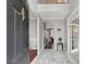 Inviting foyer with soaring ceilings, neutral paint colors, and a view into the home's living spaces at 1185 Charter Club Dr, Lawrenceville, GA 30043