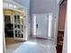 A view of the front door that has decorative sidelights and transom windows at 1185 Charter Club Dr, Lawrenceville, GA 30043