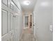 Hallway with carpet floors, white walls, and multiple storage closets, offering ample storage space at 1185 Charter Club Dr, Lawrenceville, GA 30043
