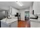 Charming kitchen with white cabinets, stainless steel appliances, and light colored marble countertops at 1185 Charter Club Dr, Lawrenceville, GA 30043
