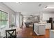 Bright open floorplan with a spacious living room, a dining nook, and a kitchen with stainless steel appliances at 1185 Charter Club Dr, Lawrenceville, GA 30043