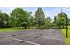 View of community parking lot with basketball hoops, playground, and green space at 1185 Charter Club Dr, Lawrenceville, GA 30043