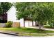 A view of the side of the house featuring a two-car garage, siding, and lawn at 1185 Charter Club Dr, Lawrenceville, GA 30043