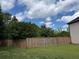 A spacious backyard with a privacy fence and green lawn at 1307 Clarecastle Ln, Buford, GA 30519