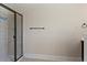 Modern bathroom featuring a glass-enclosed shower and neutral color palette at 1307 Clarecastle Ln, Buford, GA 30519