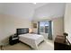 Bedroom features a bed, vaulted ceiling, window, and natural light at 1307 Clarecastle Ln, Buford, GA 30519
