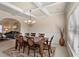 Elegant dining room featuring wainscoting, coffered ceilings, and a view to another room at 1307 Clarecastle Ln, Buford, GA 30519